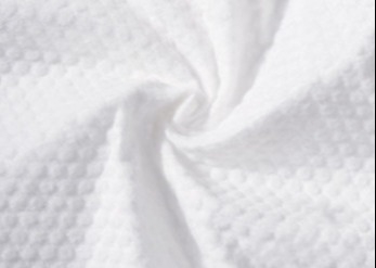 購入 圧縮されたタオルのための浮彫りにされたSpunlaceの非編まれた生地の環境保護 online manufacture